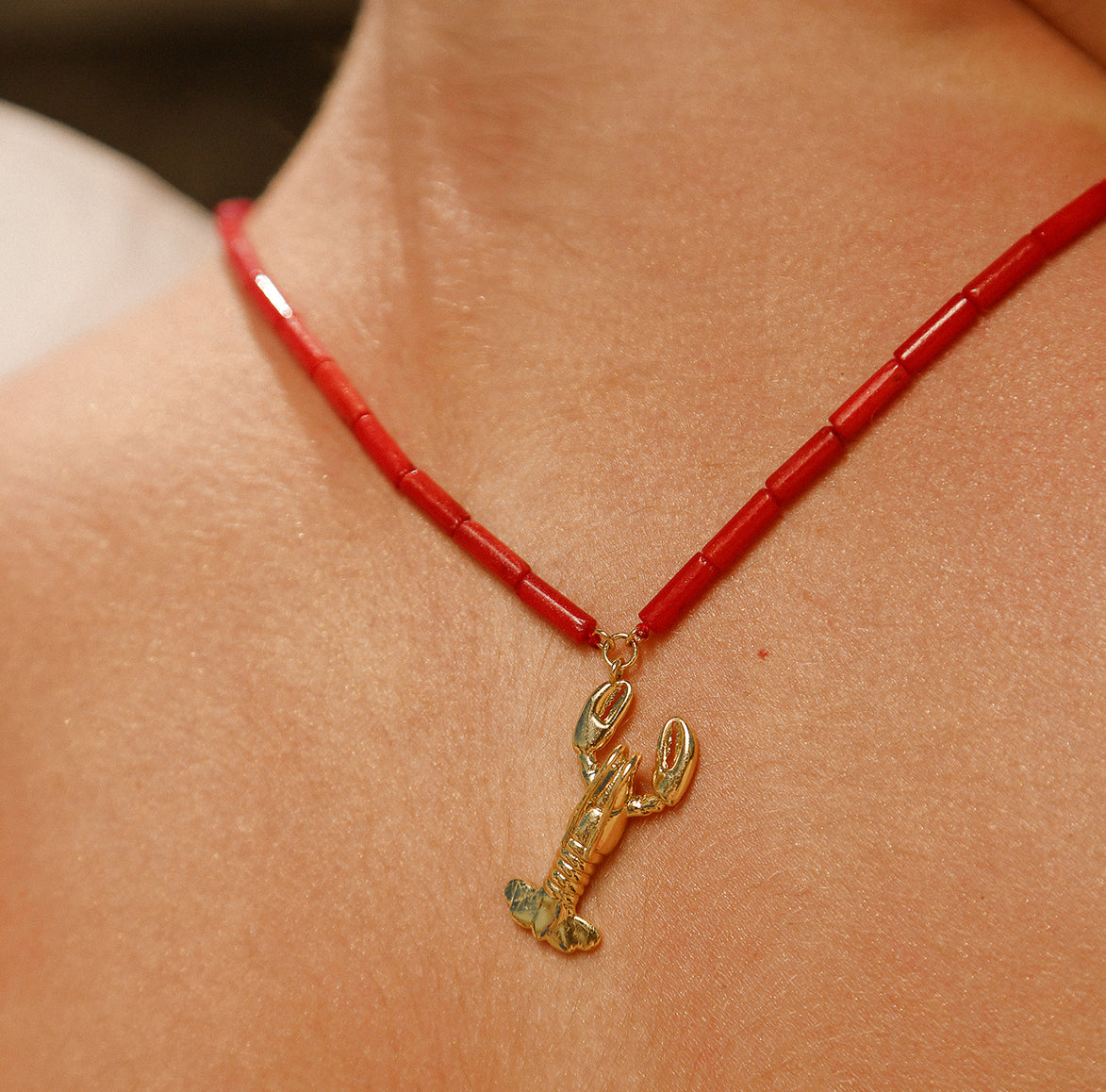 COLLIER HOMARD PERLES ROUGES